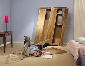 person on floor hurt from moving furniture