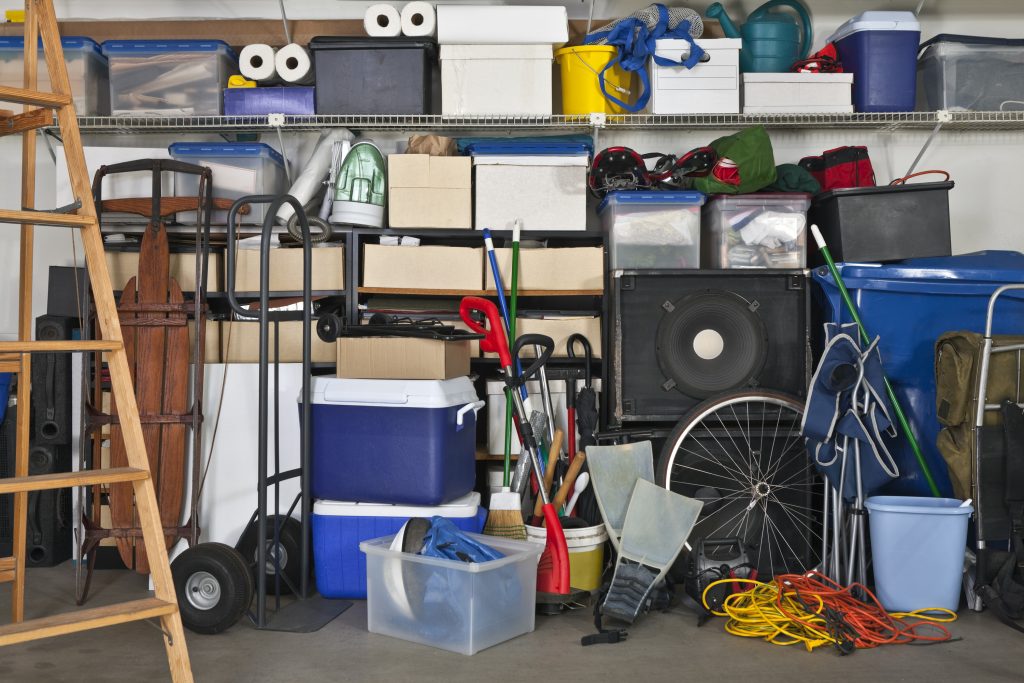 a variety of items for a move including empty bin, ice chest, boxes, bicycle
